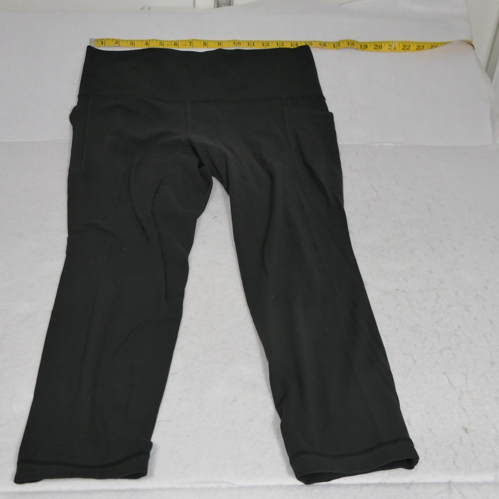 Athleta Womens Salutation Stash Leggings Size LP Black Yoga Athleisure Fitness